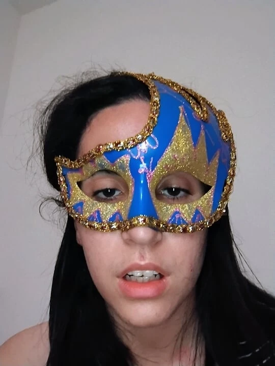 Girl in mask masturbating dances in front of camera