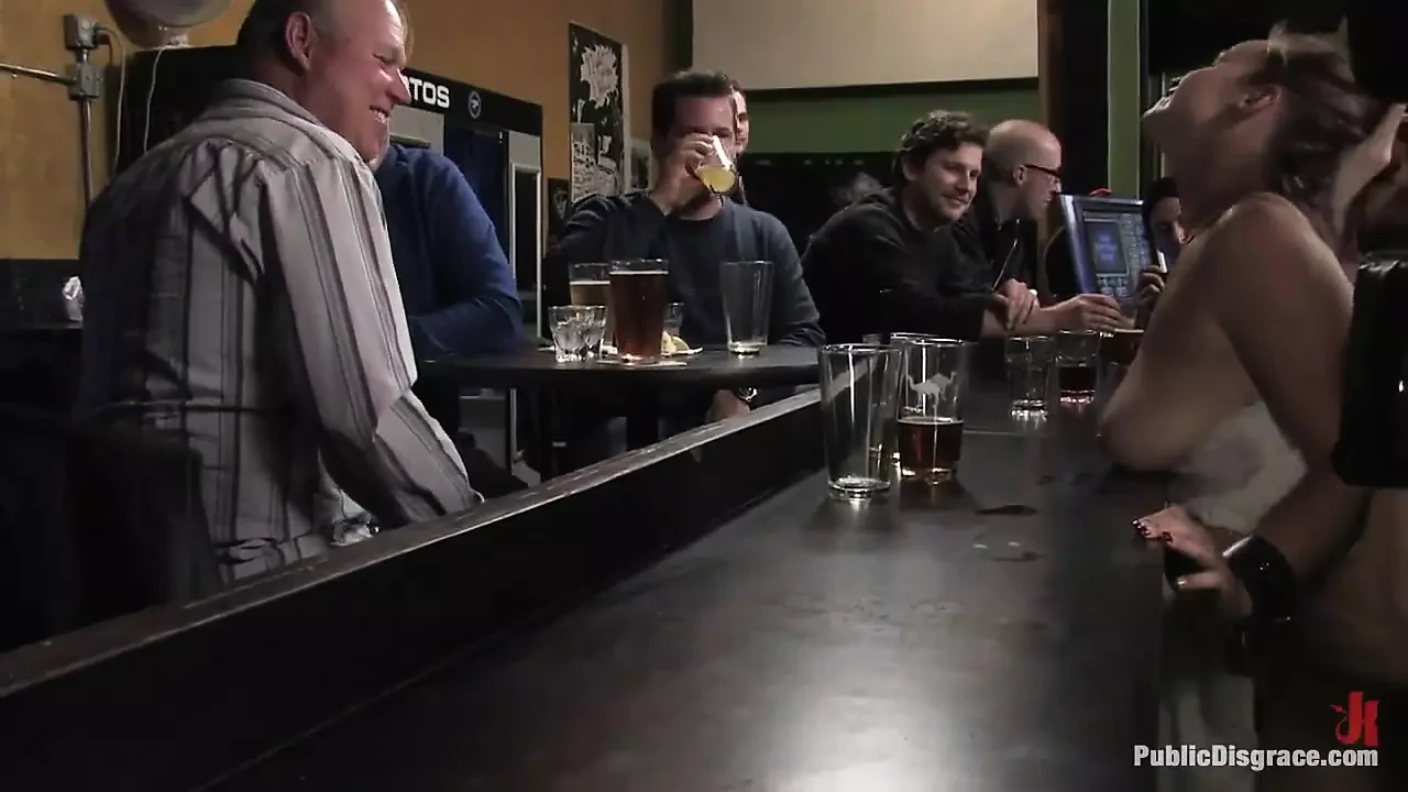 Busty Brunette Fucked in Front of a Bar Full of People