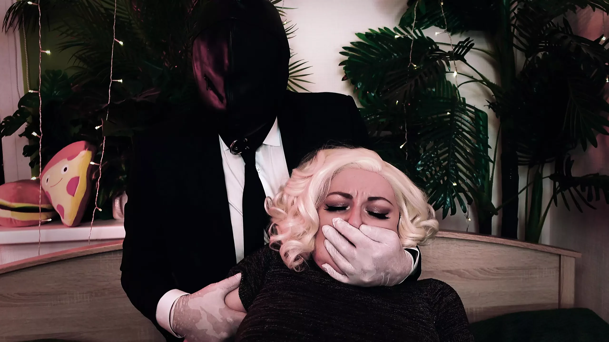 Hot kinky: man covers the girl’s mouth and then cuts her clothes off. Medical gloves and moans