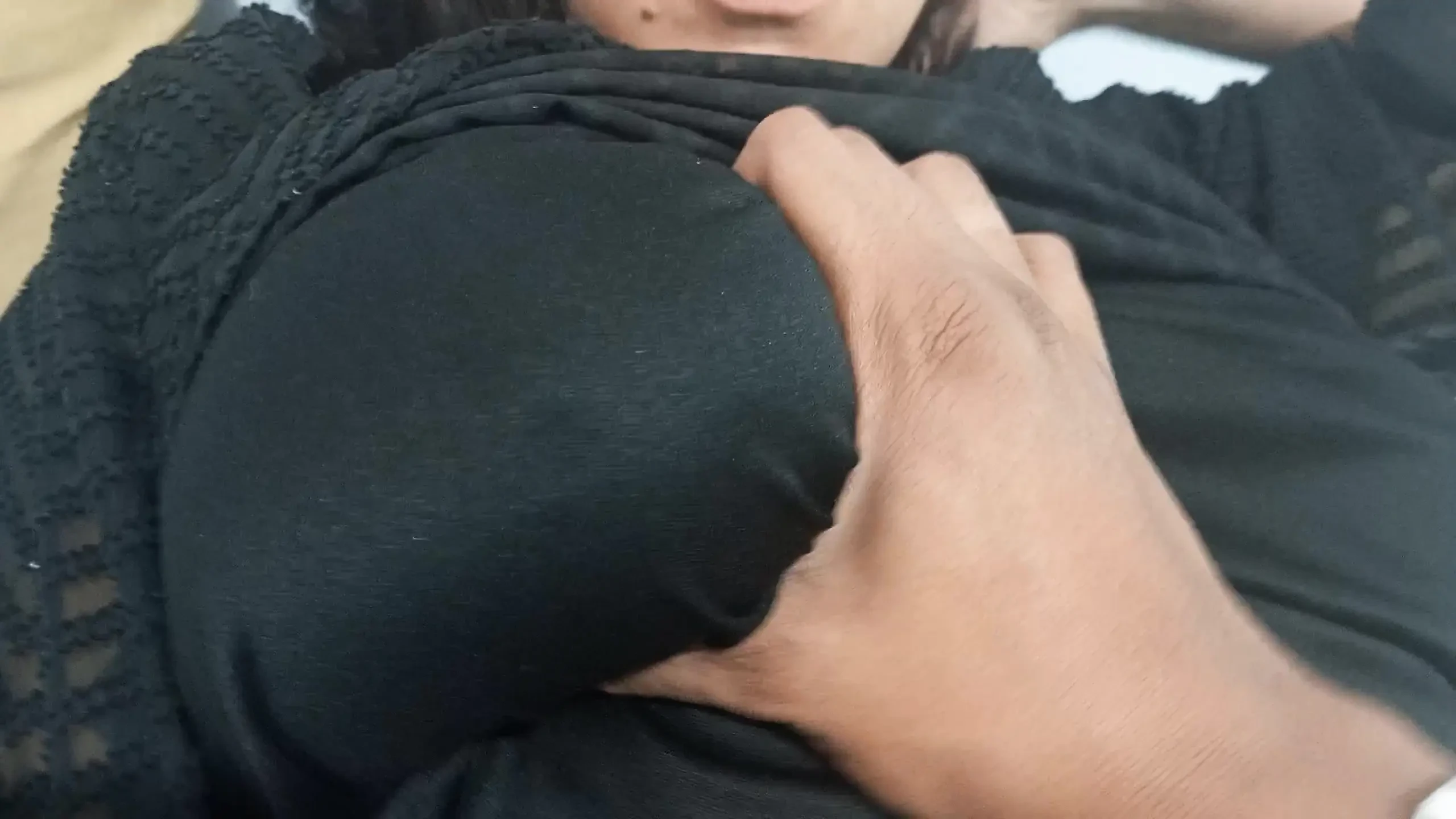 Naughty mom relaxes in bed while her stepson plays with her huge tits and fat ass.