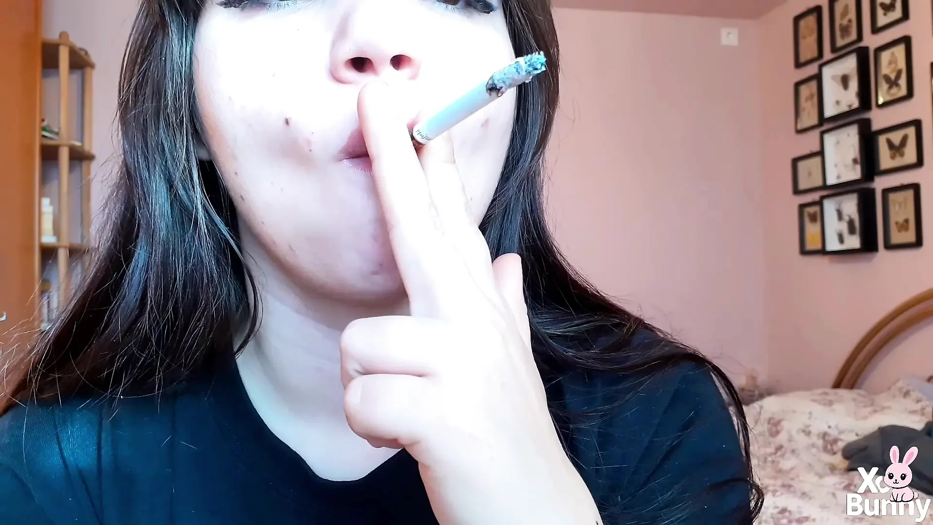 Big luscious lips with natural color lipgloss smoking cigarette